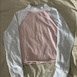 Cropped high neck long sleeve.